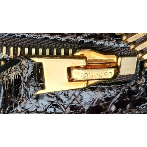 317 - A Tom Ford Python Skin Leather Handbag. Crafted in dark brown genuine python skin with a rich, natur... 