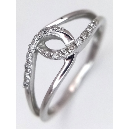320 - A 9K WHITE GOLD, DIAMOND SET, ENTWINED DESIGN RING. 1.7G, SIZE O. SC 7008