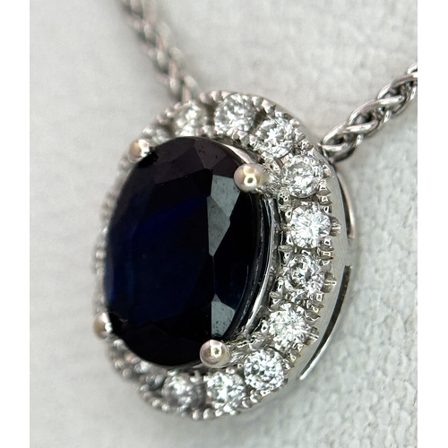 330 - An 18K White Gold, Sapphire and Diamond Oval Shaped Pendant on an 18K White Gold Chain necklace. 0.7... 