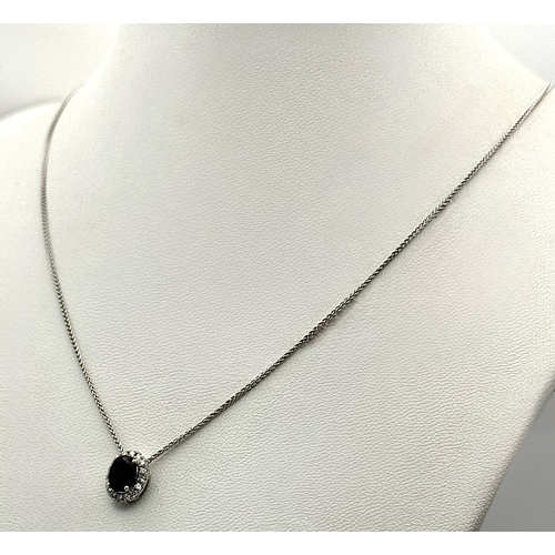 330 - An 18K White Gold, Sapphire and Diamond Oval Shaped Pendant on an 18K White Gold Chain necklace. 0.7... 