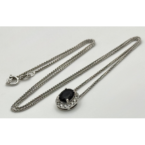 330 - An 18K White Gold, Sapphire and Diamond Oval Shaped Pendant on an 18K White Gold Chain necklace. 0.7... 
