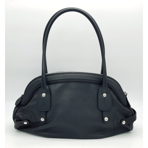 331 - A Salvatore Ferragamo Black Leather Handbag. Crafted in structured black leather with silver-tone ha... 