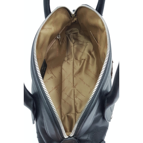 331 - A Salvatore Ferragamo Black Leather Handbag. Crafted in structured black leather with silver-tone ha... 