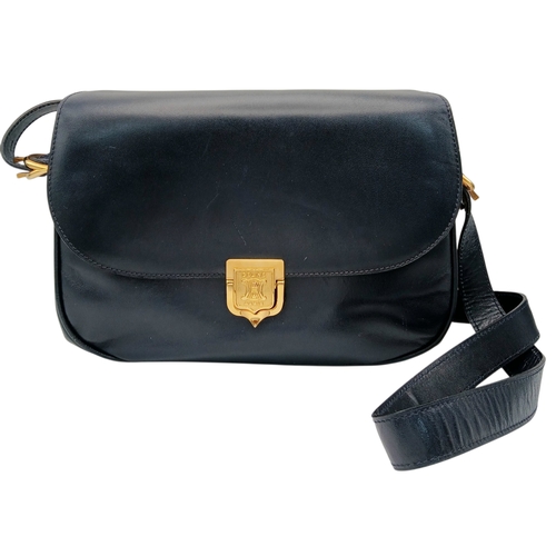 338 - A Céline Vintage Navy Triomphe Shoulder Bag. Navy leather exterior with gold-tone hardware, Triomphe... 