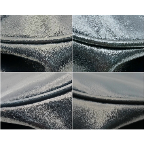 338 - A Céline Vintage Navy Triomphe Shoulder Bag. Navy leather exterior with gold-tone hardware, Triomphe... 