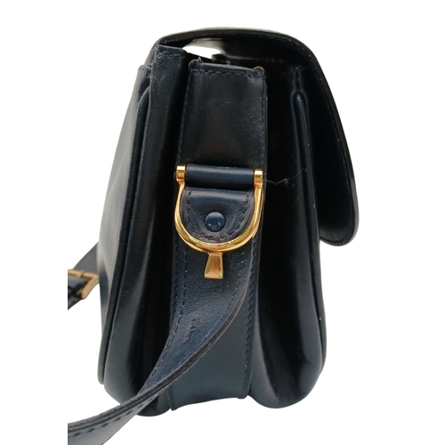 338 - A Céline Vintage Navy Triomphe Shoulder Bag. Navy leather exterior with gold-tone hardware, Triomphe... 