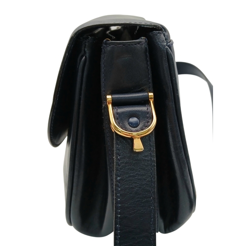 338 - A Céline Vintage Navy Triomphe Shoulder Bag. Navy leather exterior with gold-tone hardware, Triomphe... 