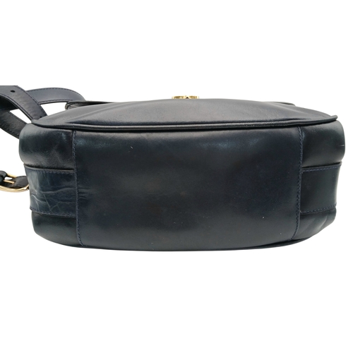 338 - A Céline Vintage Navy Triomphe Shoulder Bag. Navy leather exterior with gold-tone hardware, Triomphe... 