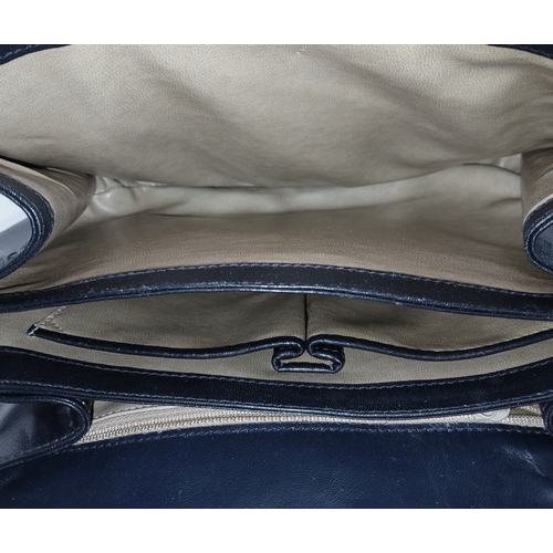 338 - A Céline Vintage Navy Triomphe Shoulder Bag. Navy leather exterior with gold-tone hardware, Triomphe... 