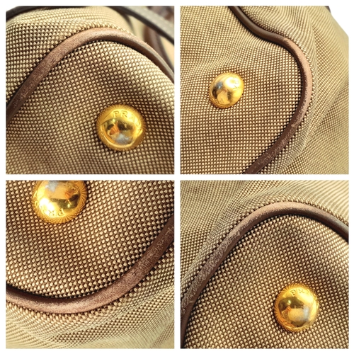 351 - A Prada Beige Canvas and Brown Leather Tote Bag. Crafted in beige canvas with an embroidered “PRADA ... 
