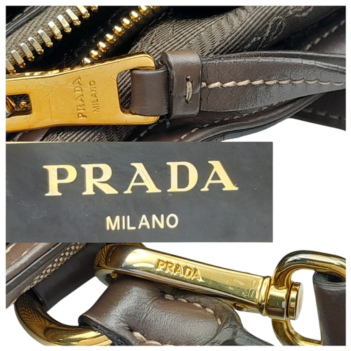 351 - A Prada Beige Canvas and Brown Leather Tote Bag. Crafted in beige canvas with an embroidered “PRADA ... 
