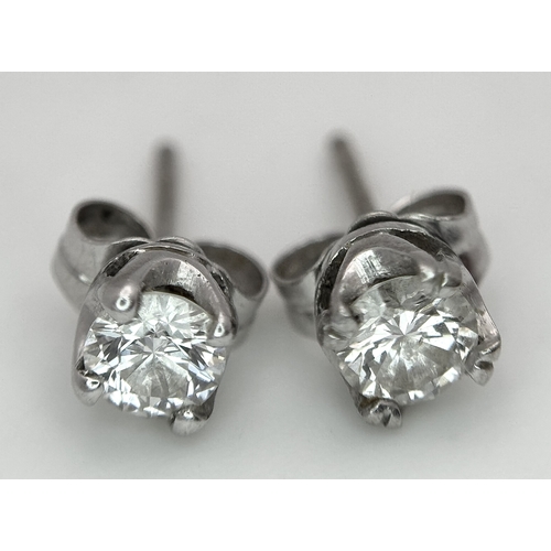 353 - A Pair of 18K White Gold and Diamond Stud Earrings. 0.70ctw. 1.2g total weight.