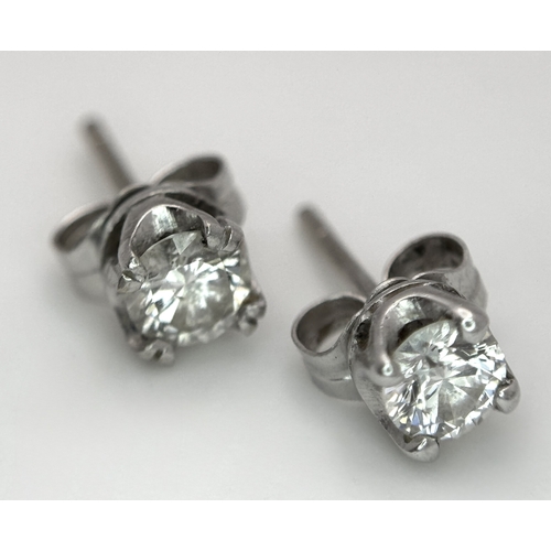 353 - A Pair of 18K White Gold and Diamond Stud Earrings. 0.70ctw. 1.2g total weight.