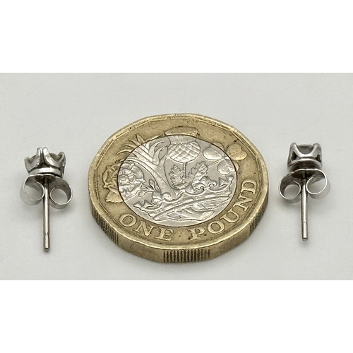 353 - A Pair of 18K White Gold and Diamond Stud Earrings. 0.70ctw. 1.2g total weight.