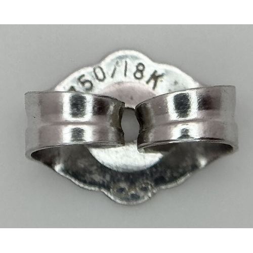 353 - A Pair of 18K White Gold and Diamond Stud Earrings. 0.70ctw. 1.2g total weight.