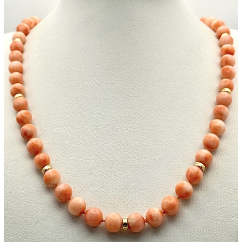 356 - An 18K Gold and Red Coral Necklace. 8mm coral beads. 60cm necklace length. 50.6g. MT16.