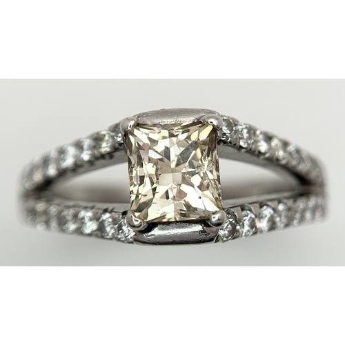 360 - An 18K Yellow Gold Diamond Cocktail Ring. A c.0.80ct radiant cut diamond sits in a split shank havin... 