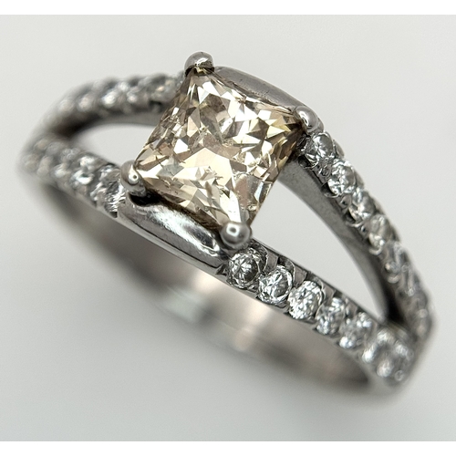 360 - An 18K Yellow Gold Diamond Cocktail Ring. A c.0.80ct radiant cut diamond sits in a split shank havin... 