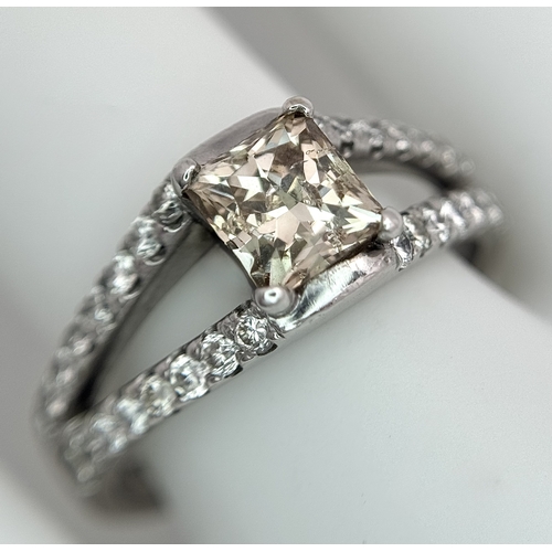 360 - An 18K Yellow Gold Diamond Cocktail Ring. A c.0.80ct radiant cut diamond sits in a split shank havin... 