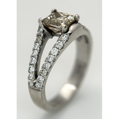 360 - An 18K Yellow Gold Diamond Cocktail Ring. A c.0.80ct radiant cut diamond sits in a split shank havin... 