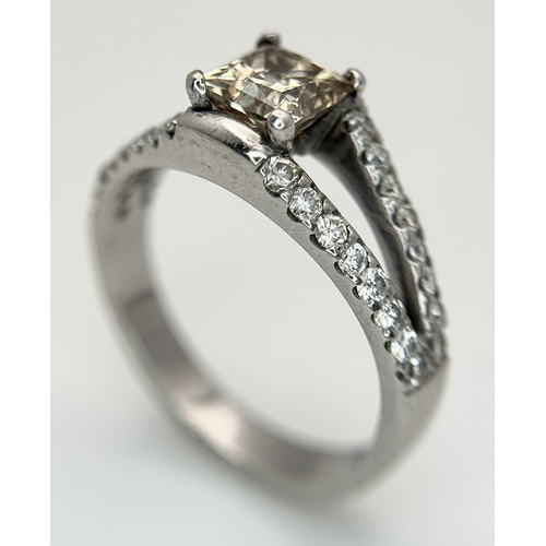 360 - An 18K Yellow Gold Diamond Cocktail Ring. A c.0.80ct radiant cut diamond sits in a split shank havin... 
