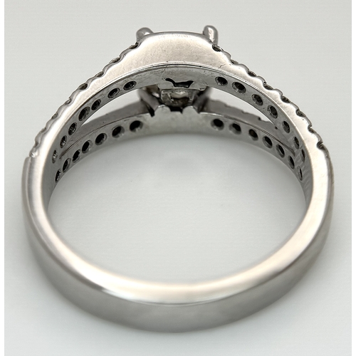 360 - An 18K Yellow Gold Diamond Cocktail Ring. A c.0.80ct radiant cut diamond sits in a split shank havin... 