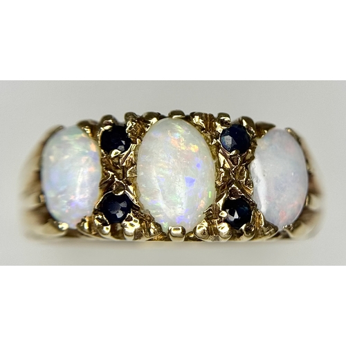 708 - A 9K Yellow Gold Opal and Blue Stone Ring. Size O 1/2 - P. 3.1g total weight. Ref: 1/41156