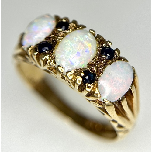 708 - A 9K Yellow Gold Opal and Blue Stone Ring. Size O 1/2 - P. 3.1g total weight. Ref: 1/41156