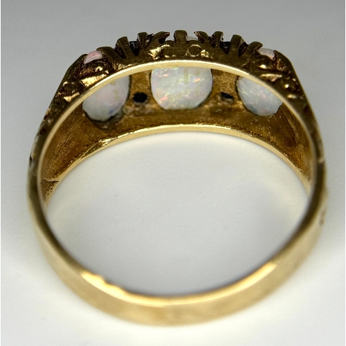 708 - A 9K Yellow Gold Opal and Blue Stone Ring. Size O 1/2 - P. 3.1g total weight. Ref: 1/41156