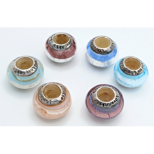 85 - A Lovelinks 925 Silver Charm Bead Set. Comprising a selection of glass charm beads with 925 silver c... 