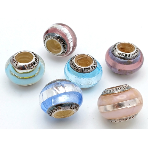 85 - A Lovelinks 925 Silver Charm Bead Set. Comprising a selection of glass charm beads with 925 silver c... 
