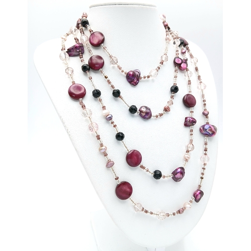 184 - A Multi-Strand Freshwater Pearl with Bead Necklace. Comprising multiple strands of clear and coloure... 