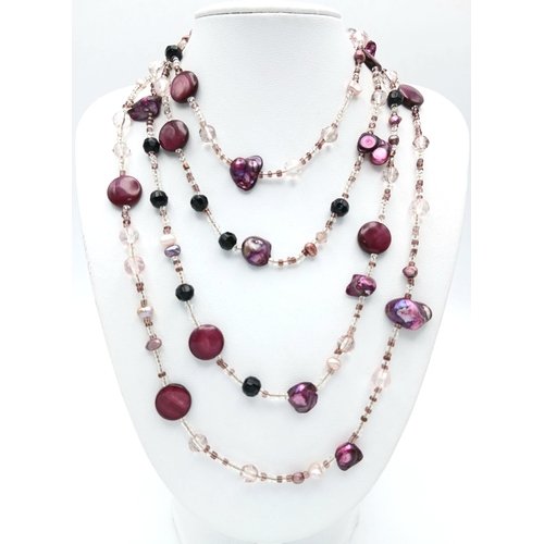 184 - A Multi-Strand Freshwater Pearl with Bead Necklace. Comprising multiple strands of clear and coloure... 