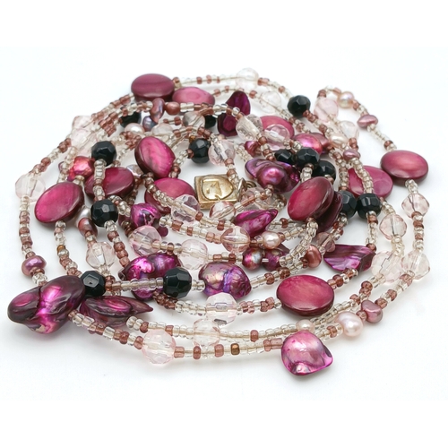 184 - A Multi-Strand Freshwater Pearl with Bead Necklace. Comprising multiple strands of clear and coloure... 