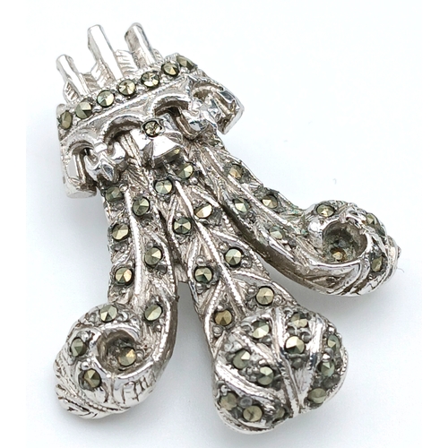 226 - A Prince of Wales Feathers Marcasite Set Brooch. Featuring a stylised three-feather motif set with m... 