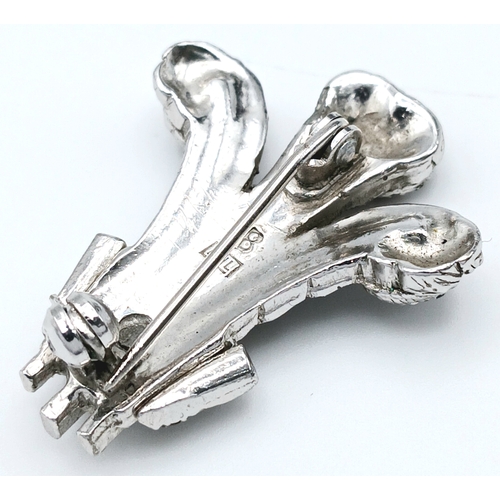 226 - A Prince of Wales Feathers Marcasite Set Brooch. Featuring a stylised three-feather motif set with m... 