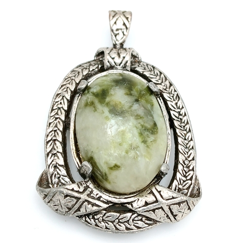 304 - A Green Hardstone Pendant in Ornate Mount. Approx 5cm x 3cm. Please see photos for details.