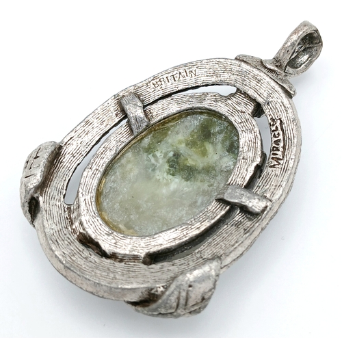 304 - A Green Hardstone Pendant in Ornate Mount. Approx 5cm x 3cm. Please see photos for details.