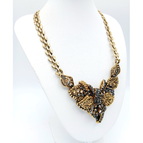 310 - A stunning chain necklace with an ornate central stoned set pendant. Necklace length approx 30cm, pe... 