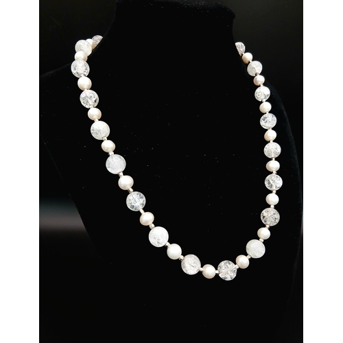 325 - An Elegant Crackle Glass Bead with Freshwater Pearl Necklace. Approx 46cm in length. Please see phot... 