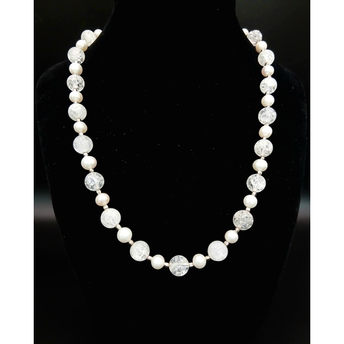 325 - An Elegant Crackle Glass Bead with Freshwater Pearl Necklace. Approx 46cm in length. Please see phot... 