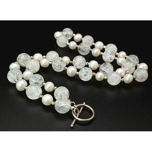 325 - An Elegant Crackle Glass Bead with Freshwater Pearl Necklace. Approx 46cm in length. Please see phot... 