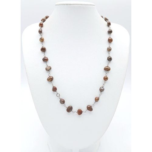 339 - A Lovely Brown Freshwater Pearl Necklace. Approx 40cm in length. Please see photos for details.