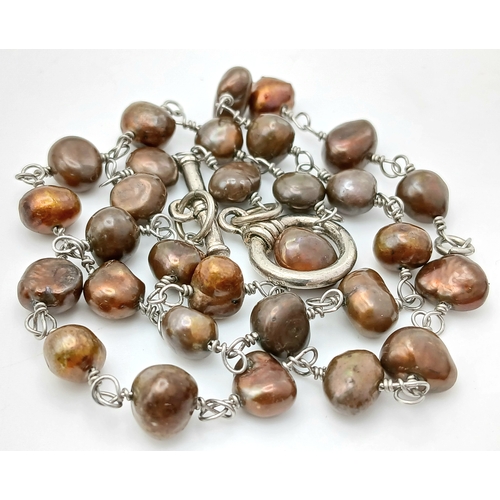 339 - A Lovely Brown Freshwater Pearl Necklace. Approx 40cm in length. Please see photos for details.