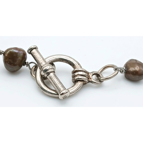 339 - A Lovely Brown Freshwater Pearl Necklace. Approx 40cm in length. Please see photos for details.