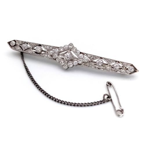 40 - An Exceptional Antique Art Deco Platinum, 18K Gold, Diamond Bar Brooch. Intricate filigree and openw... 