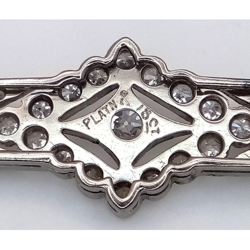 40 - An Exceptional Antique Art Deco Platinum, 18K Gold, Diamond Bar Brooch. Intricate filigree and openw... 