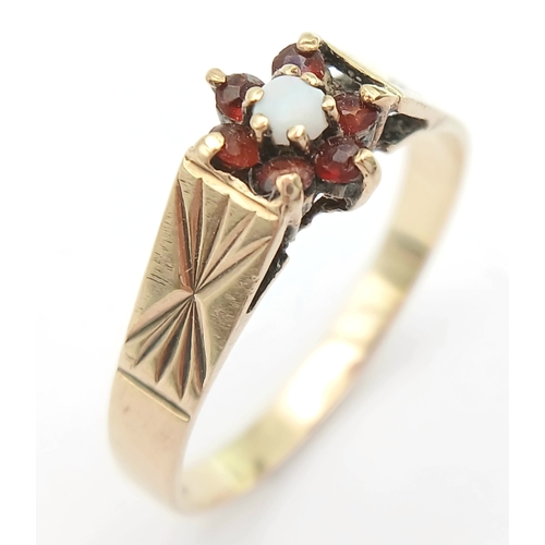 1176 - A Hallmarked 1981 Vintage 9K Gold Opal and Garnet Set Ring Size R. The ring measures 8mm Wide at the... 