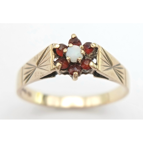 1176 - A Hallmarked 1981 Vintage 9K Gold Opal and Garnet Set Ring Size R. The ring measures 8mm Wide at the... 