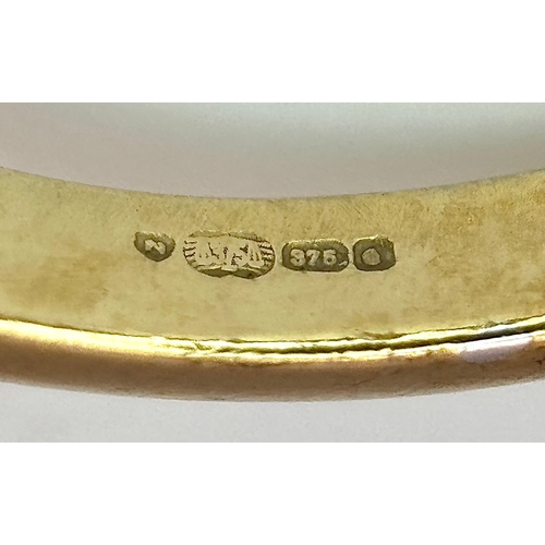 1266 - An Impressive 9K Gold Blue Topaz and Diamond Set Ring Size Q1/2. The Ring is set with a Centre Oval ... 